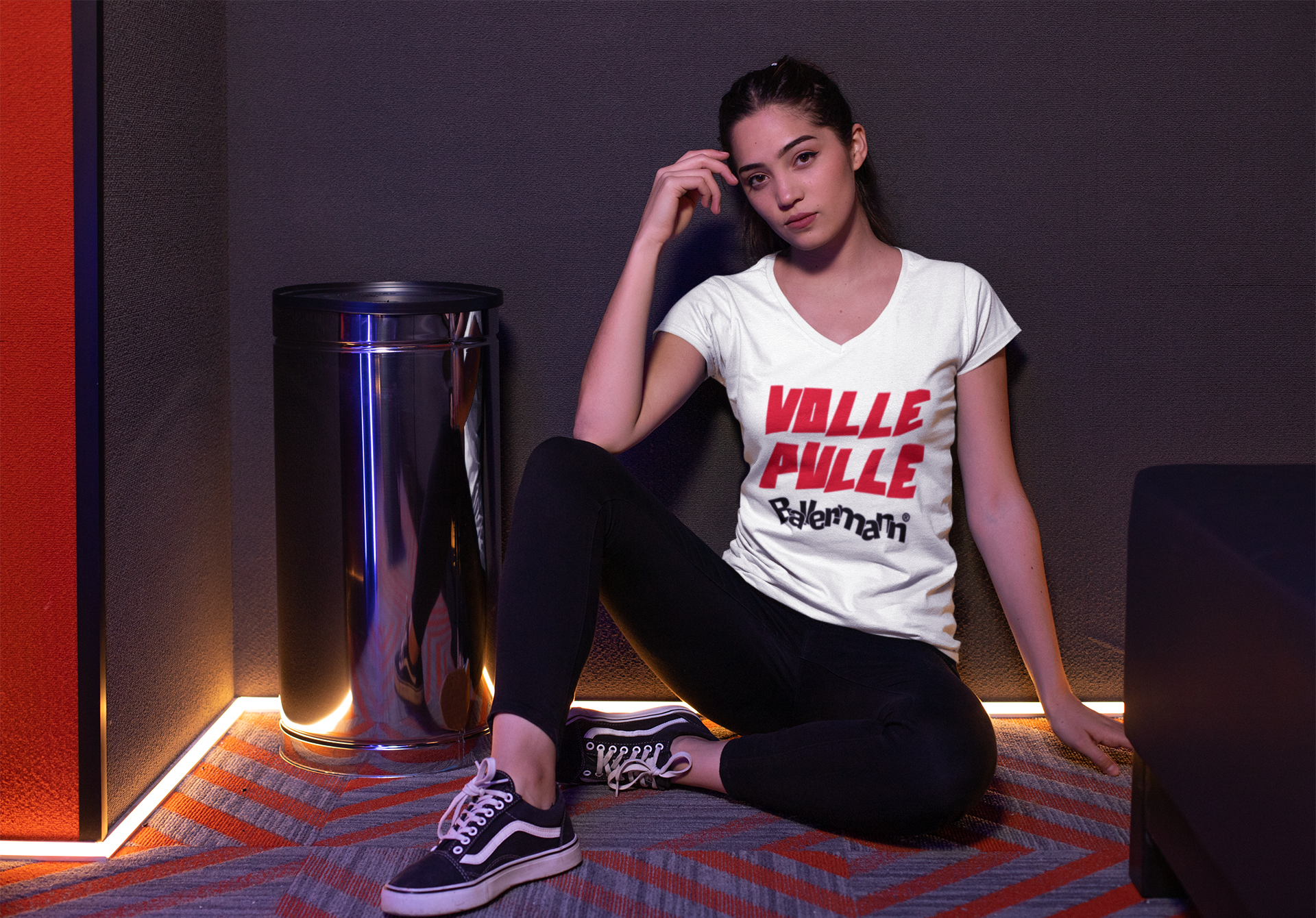 v-neck-tee-mockup-of-a-girl-wearing-vans-in-a-led-illuminated-corner-24929